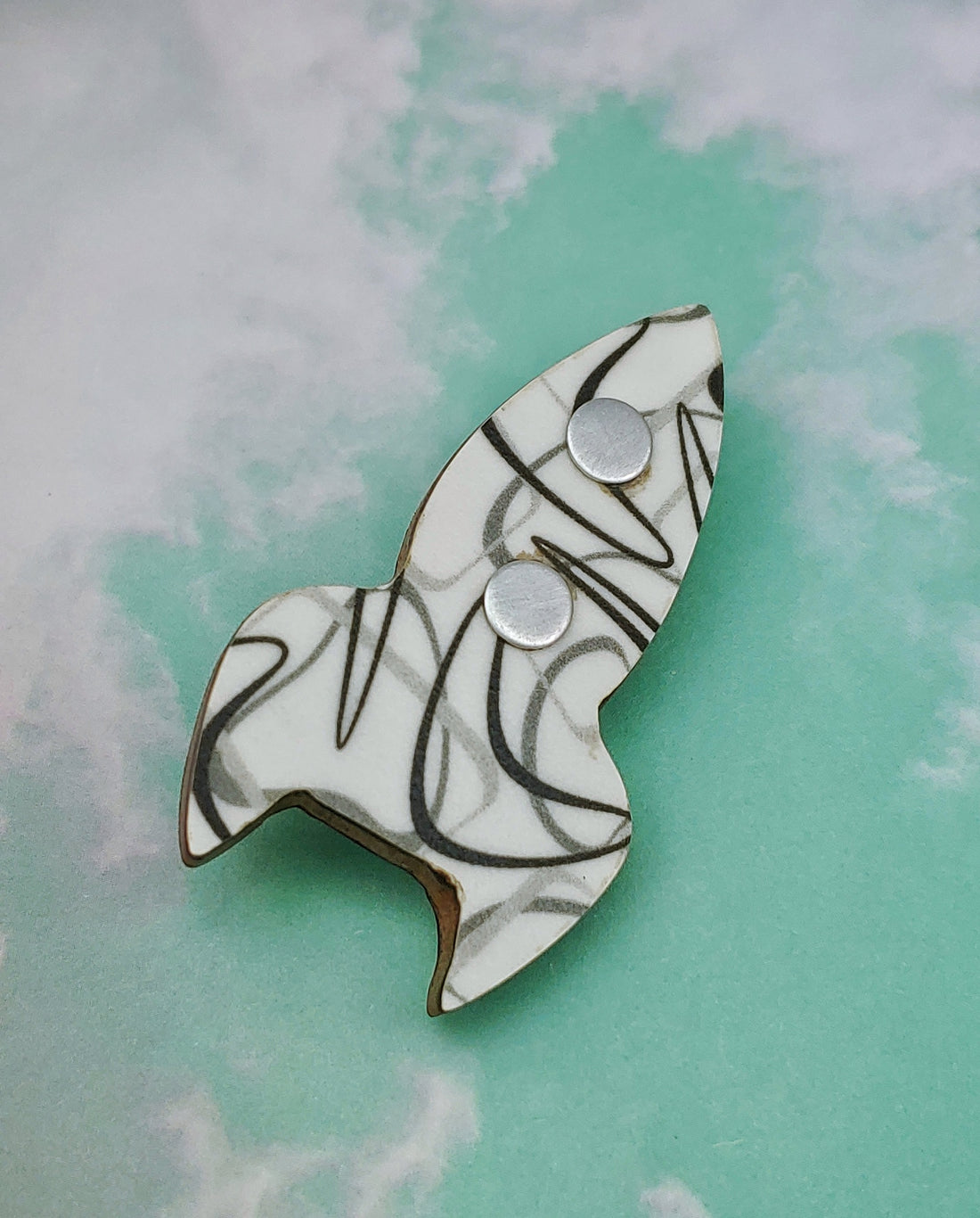 boomerang laminate rocket ship on wood