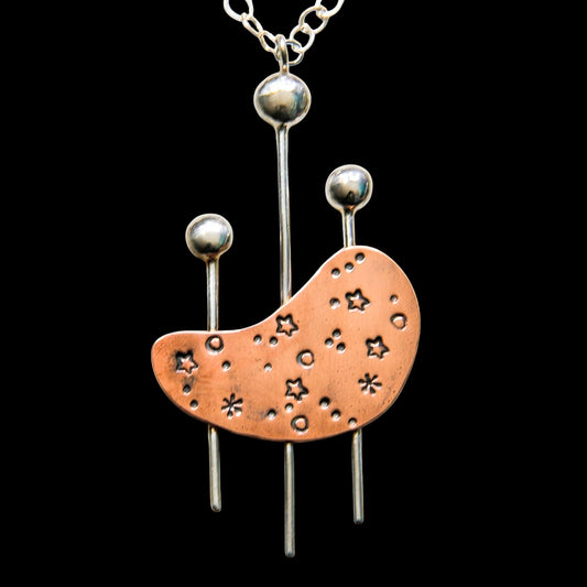 Kidney shaped copper necklace with sterling silver inspired by mid century modern design