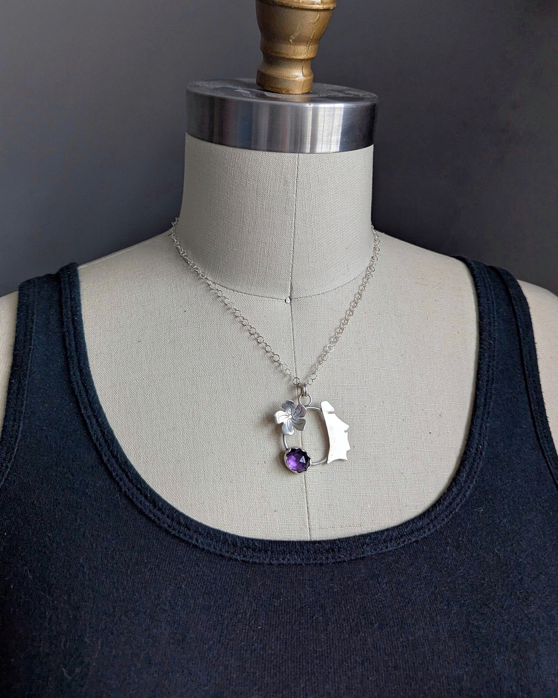 View on dress form of sterling silver moai necklace with amethyst