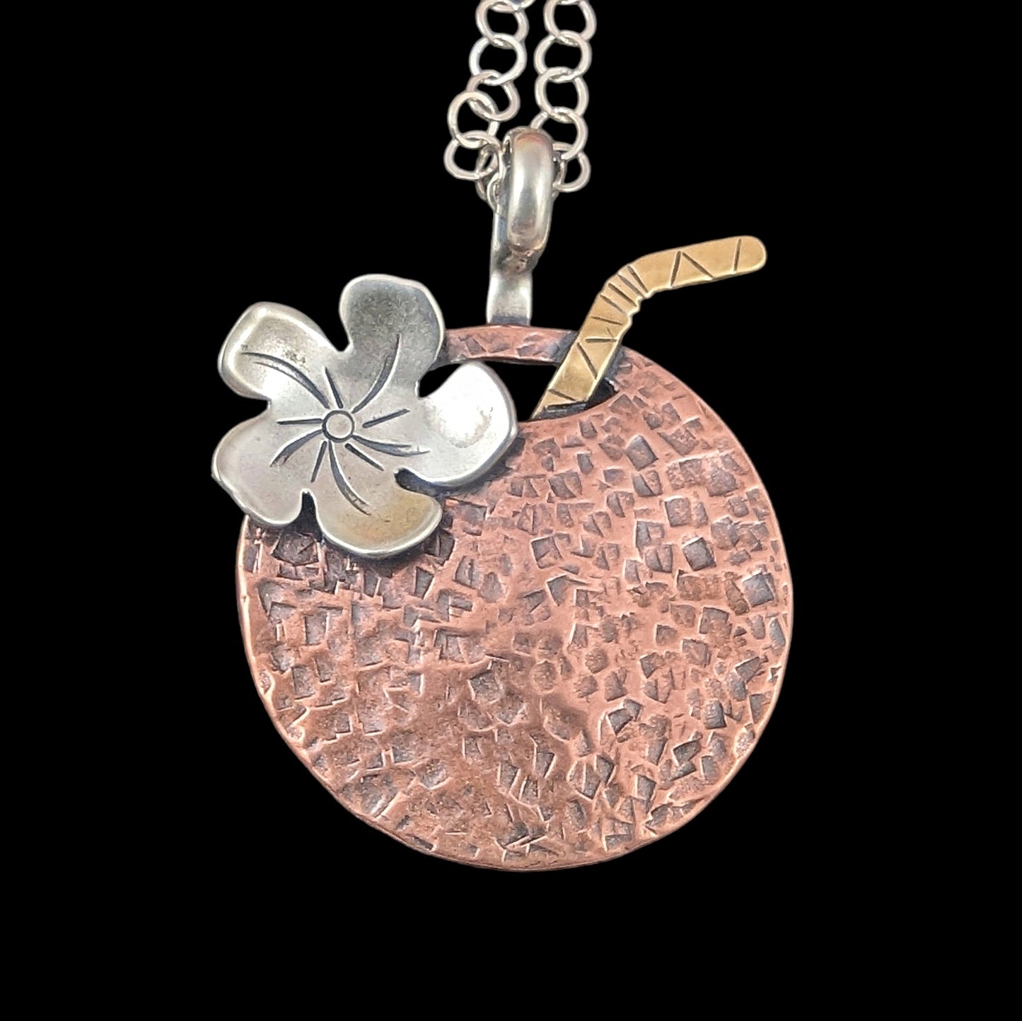 Tiki cocktail copper hammed necklace in the shape of a coconut