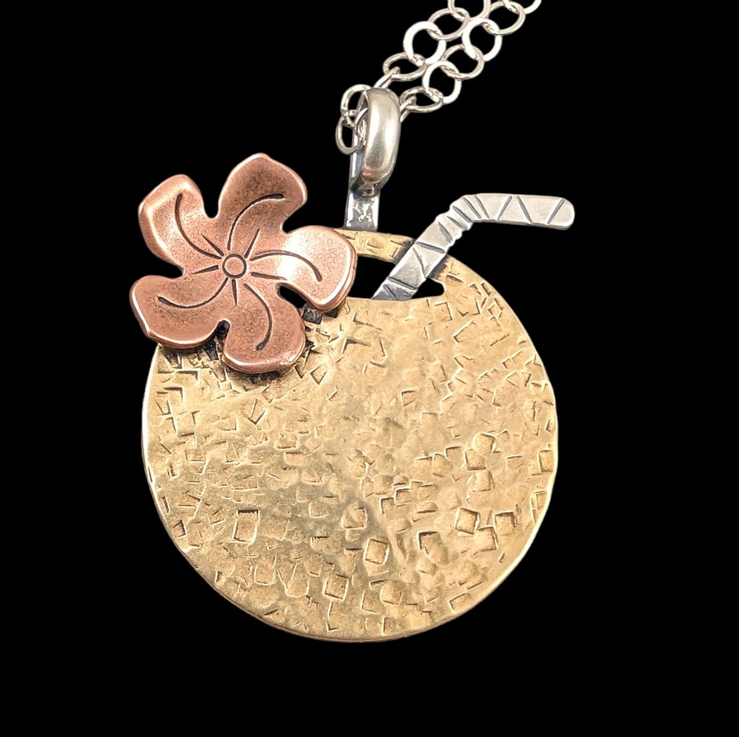 Brass Tiki necklace shaped as a coconut with straw and flower