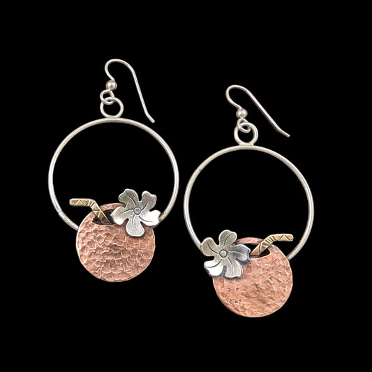 Copper and sterling silver coconut Tiki earrings on black background