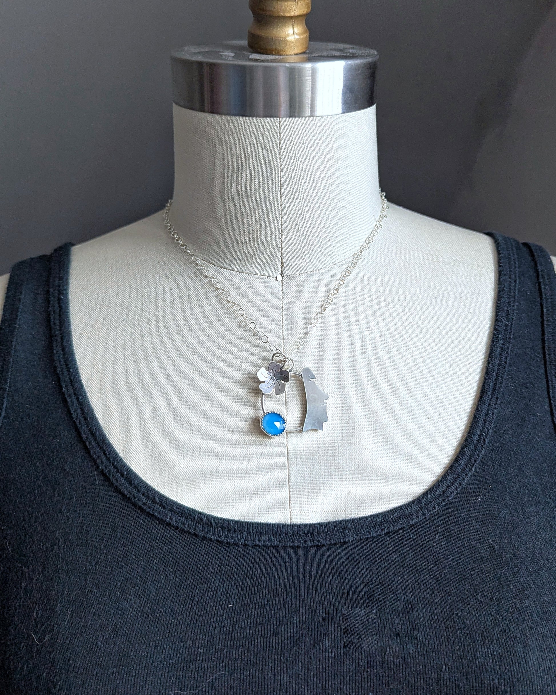 Sterling silver moai necklace on dress form