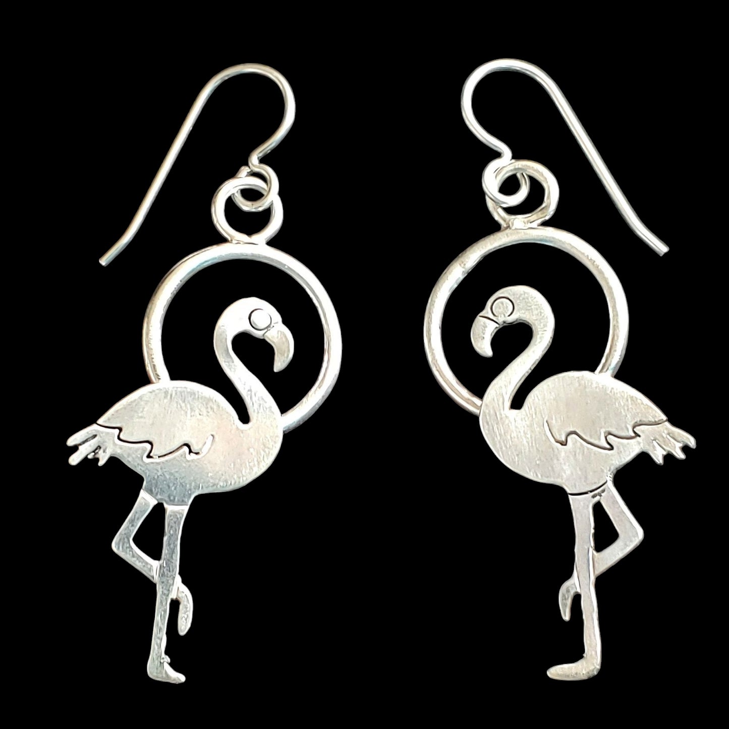 Handmade sterling silver flamingo earrings on circles that are so lightweight!