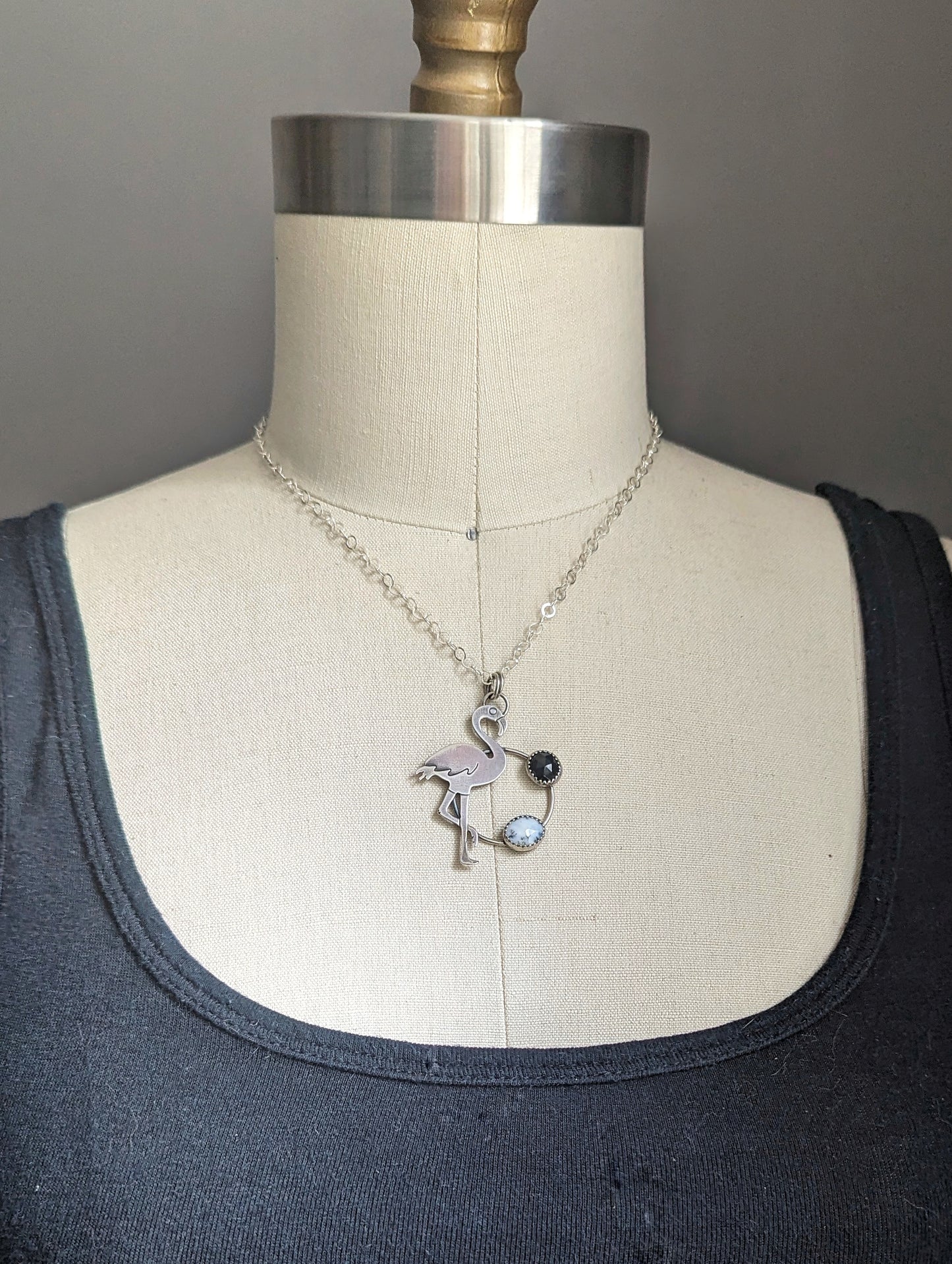 Flamingo with dendritic opal and onyx on a bust form