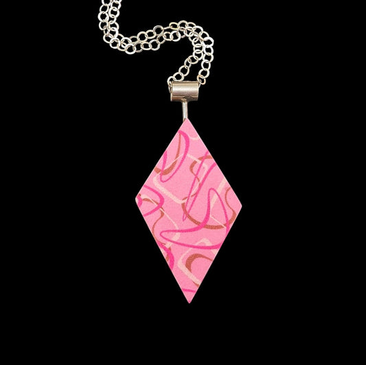 Pink boomerang laminate diamond shaped necklace with a retro aesthetic