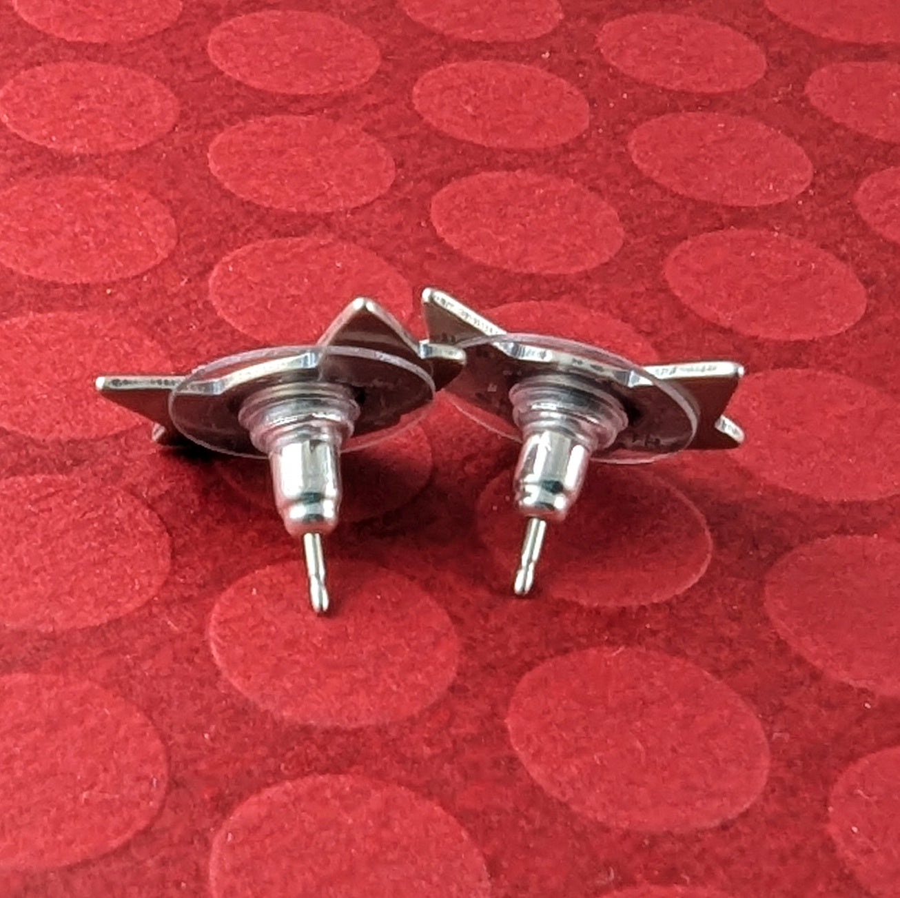 Mid century modern cat earrings made in sterling silver showing the back