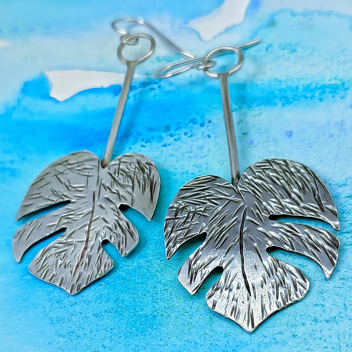 Handmade sterling silver monstera leaf lightweight drop earrings perfect for all of your Tiki outfits