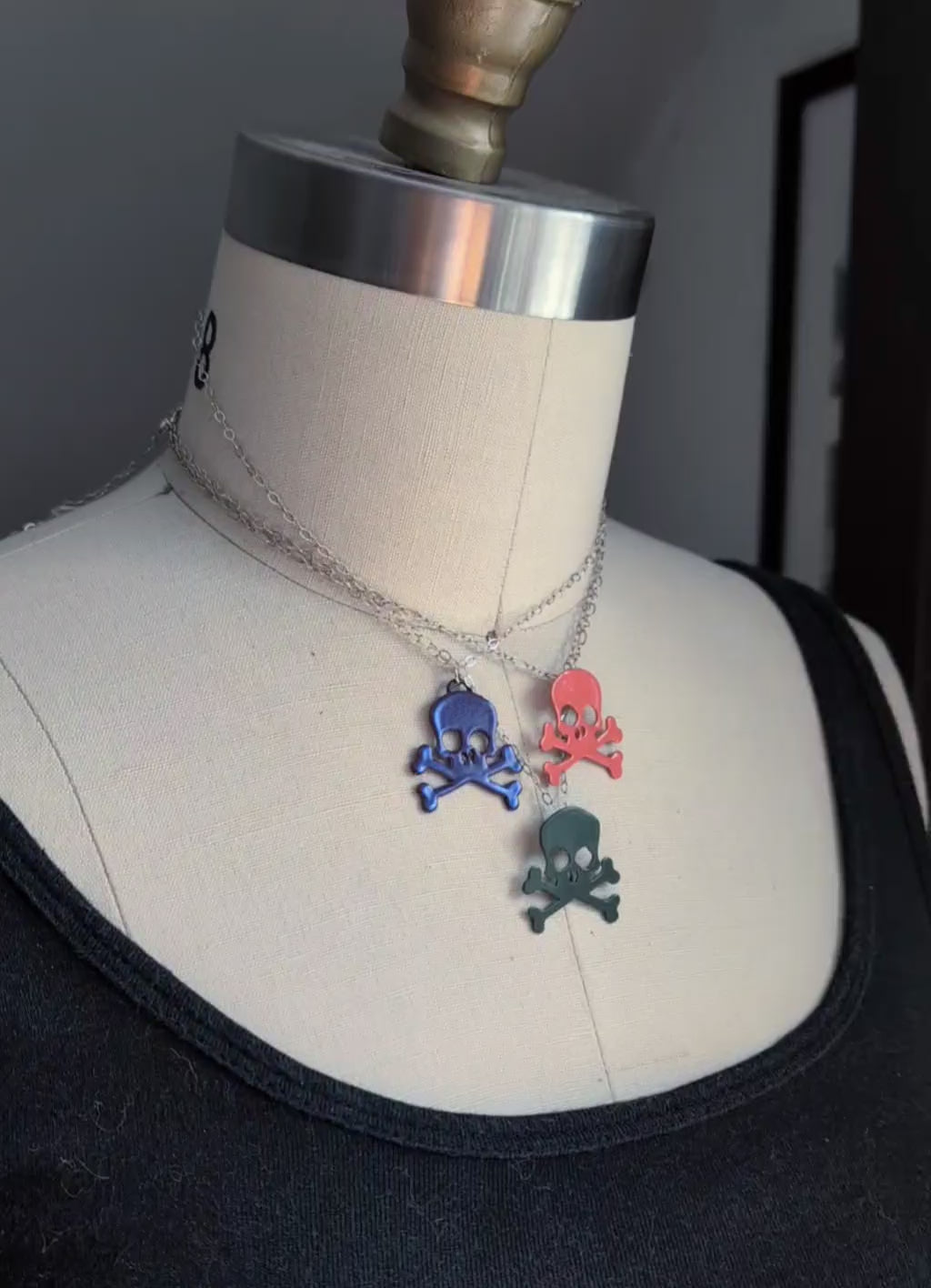 Video of all three colors of powdercoated skull necklaces