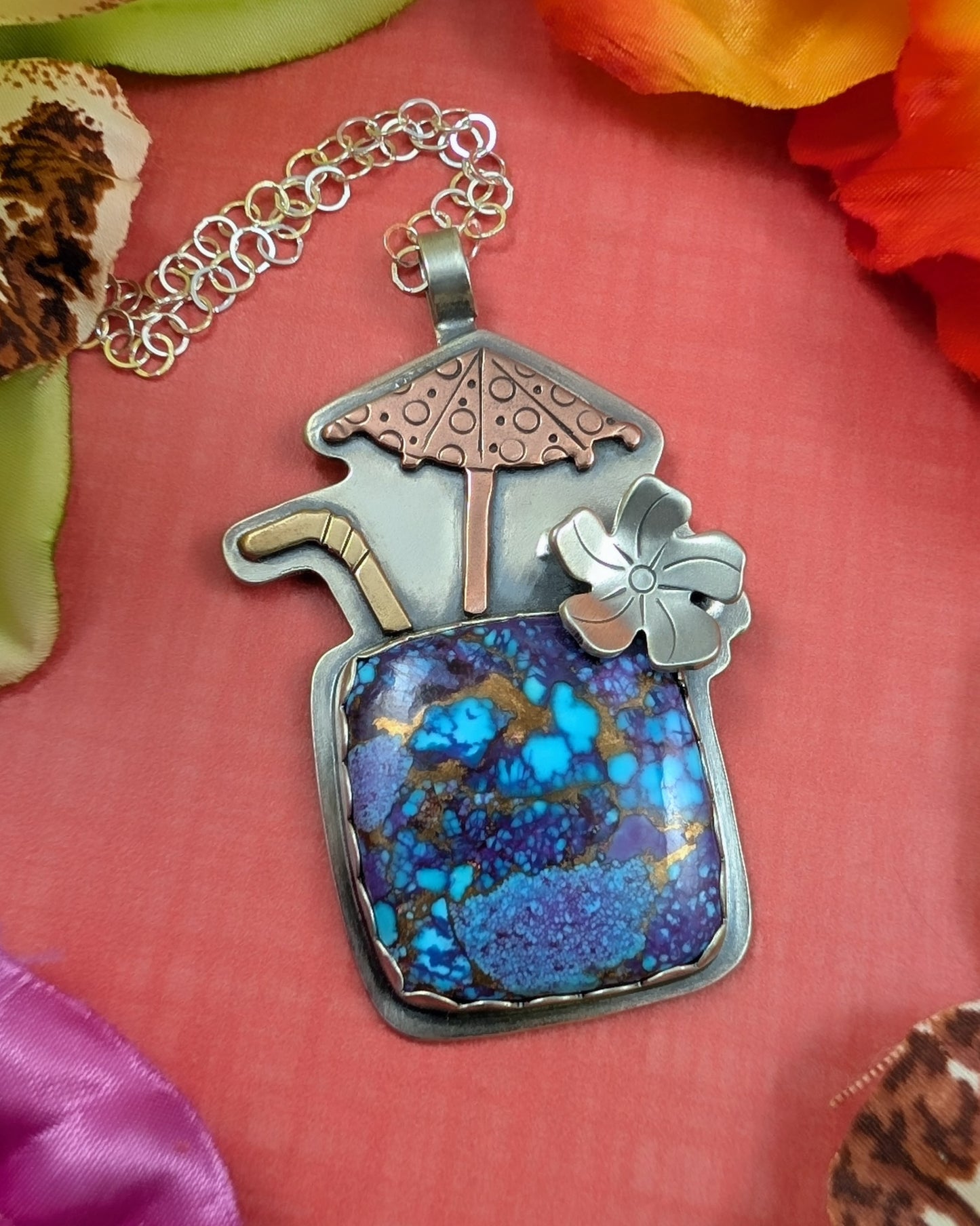Purple copper turquoise tiki drink necklace on orange background