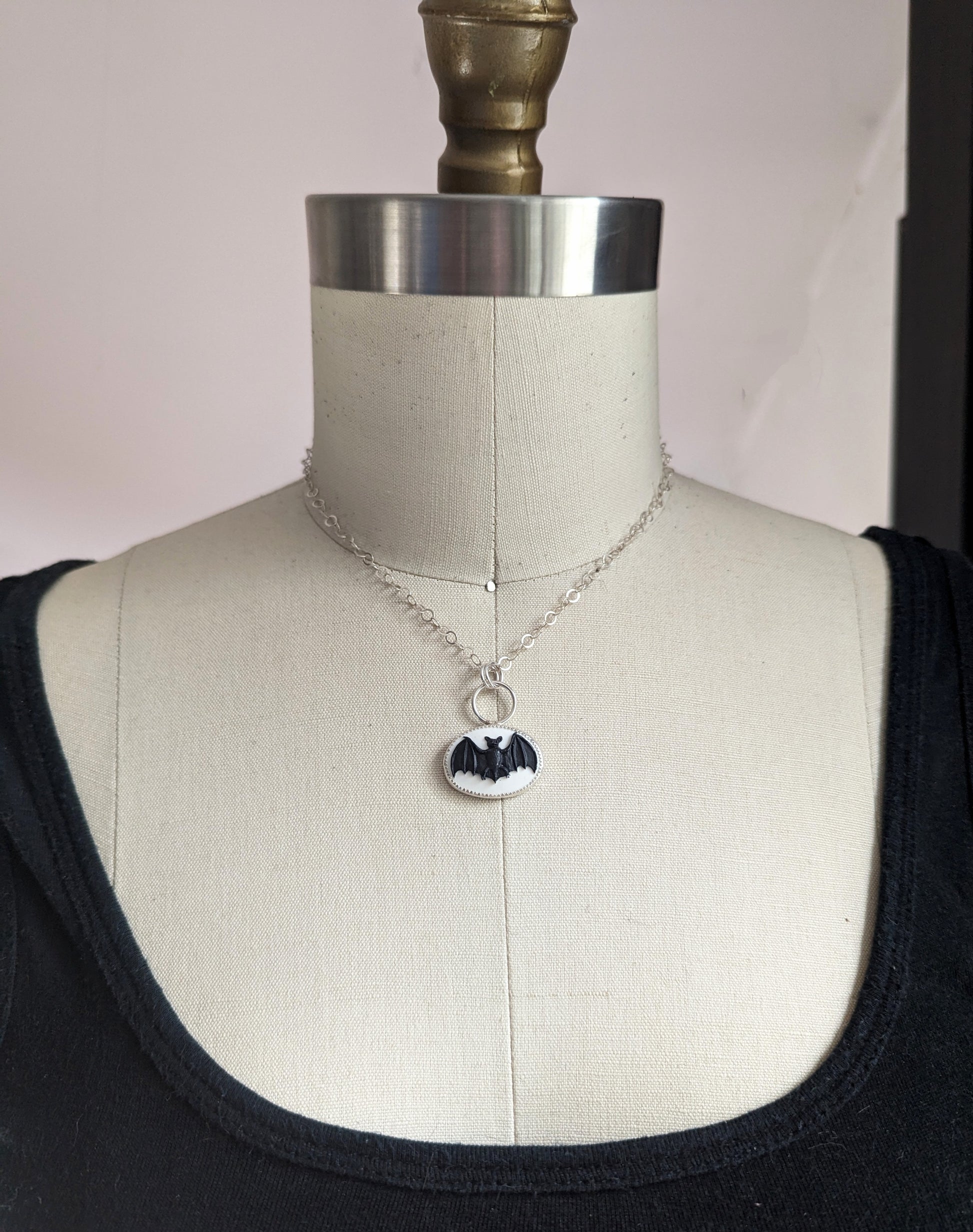 Black and white bat cameo necklace made of sterling silver