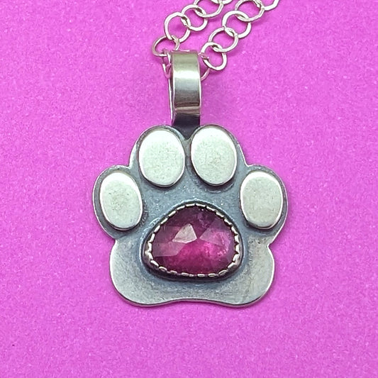 Sterling silver paw print necklace with rosecut ruby