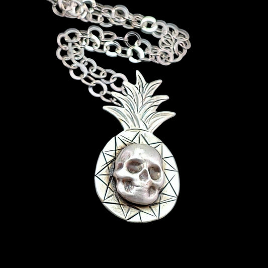 Handmade sterling silver skull set on top of a detailed pineapple creating a super cool Tiki necklace