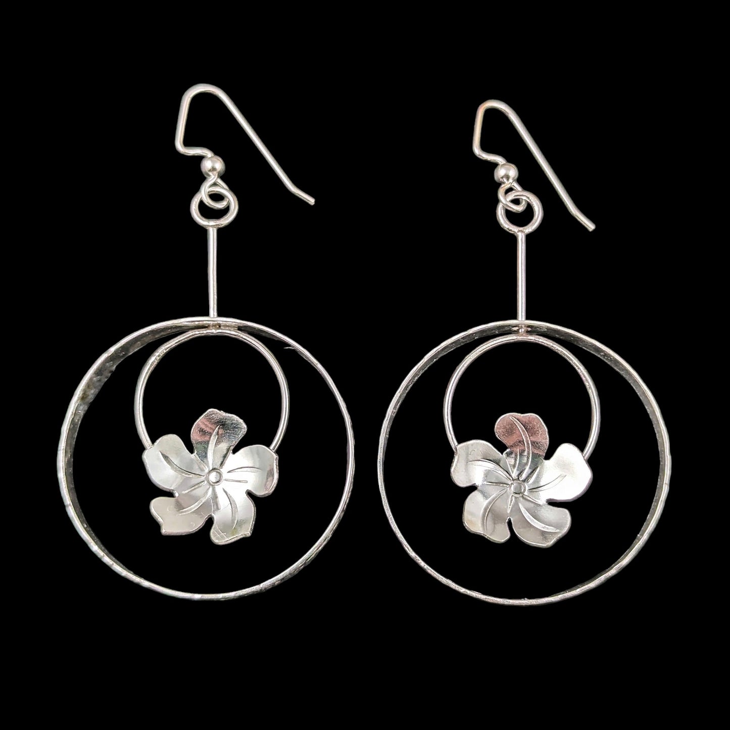 Sterling silver plumeria flower earrings in a circle in a circle