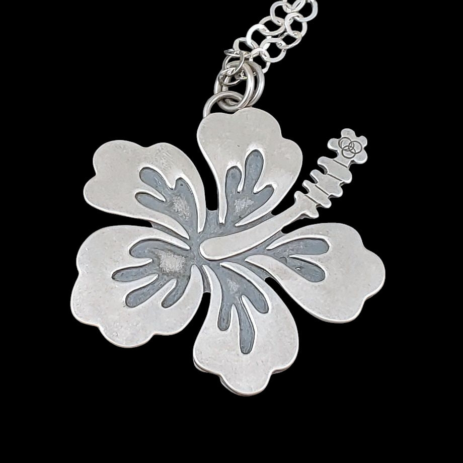 Sterling silver hibiscus necklace that goes nicely with Tiki outfits