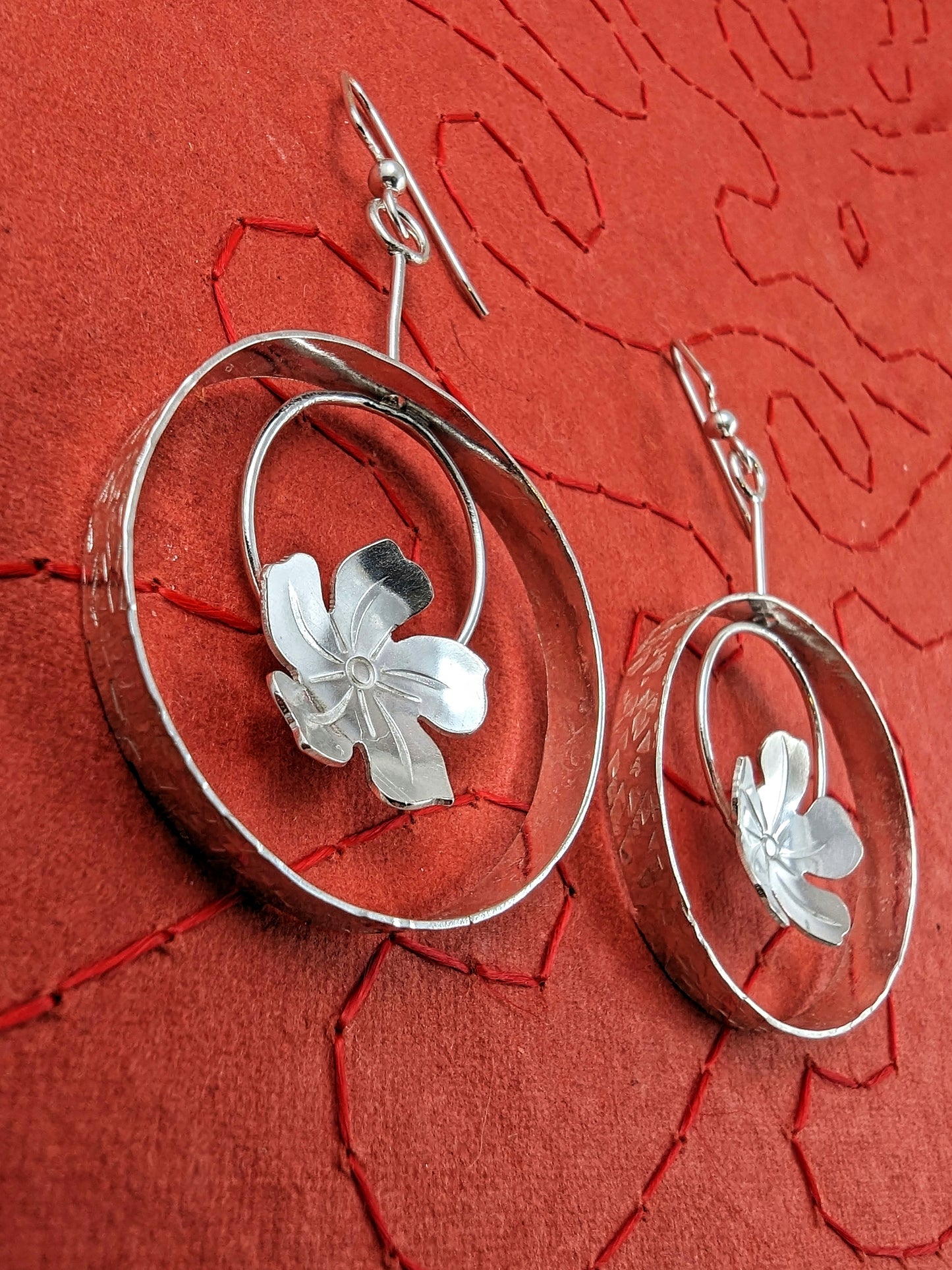 Side view sterling silver plumeria flower dangle earrings