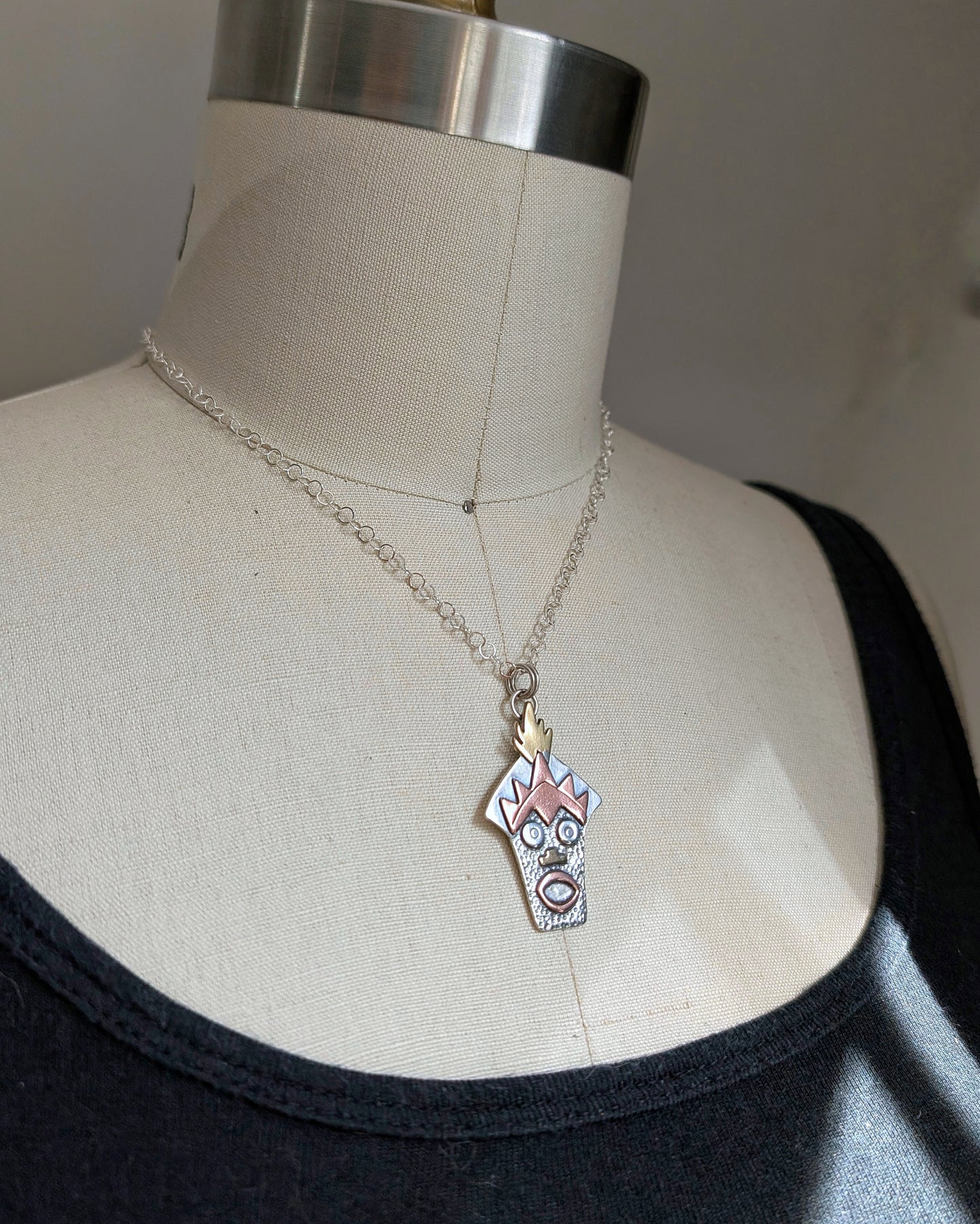Sterling silver Witch Doctor with Hawaiian mask necklace on a mannequin