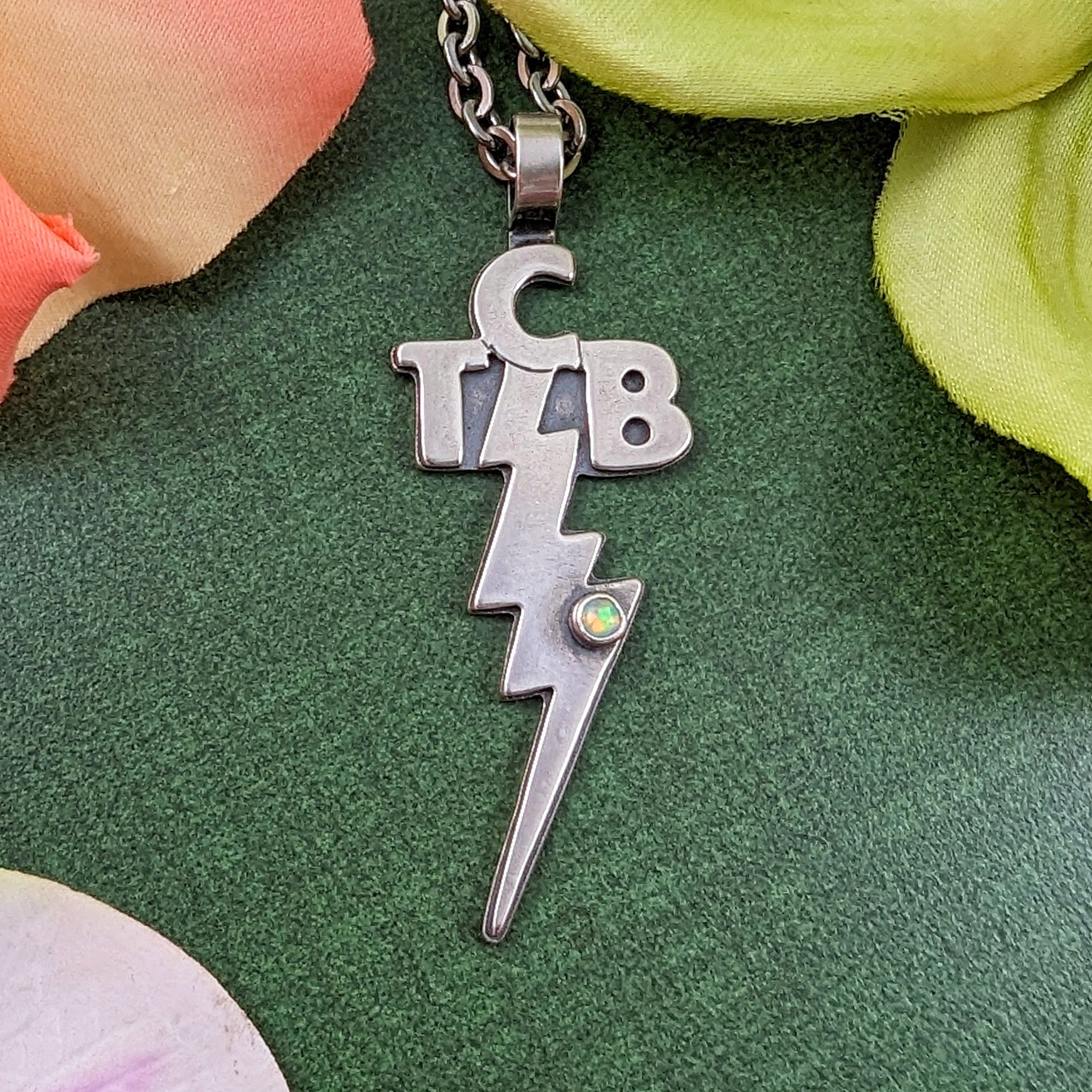 Elvis Presley's TCB necklace with gemstone