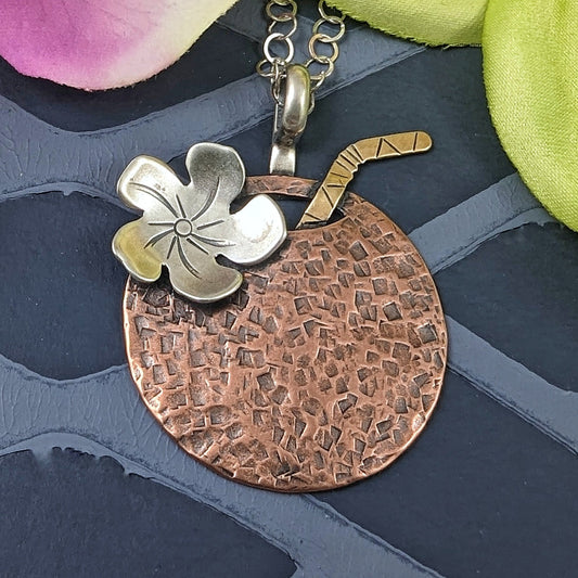 Handmade Tiki drink necklace shaped like a coconut in copper with straw