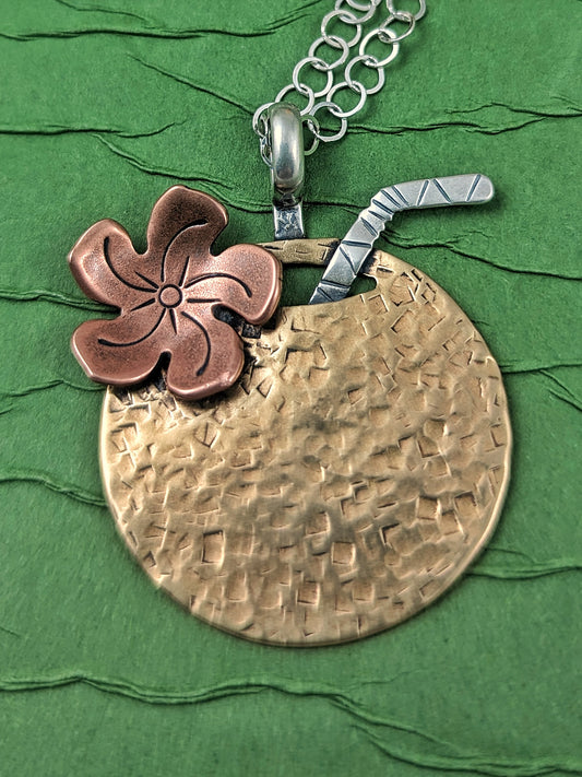 Brass coconut shaped Tiki necklace with straw