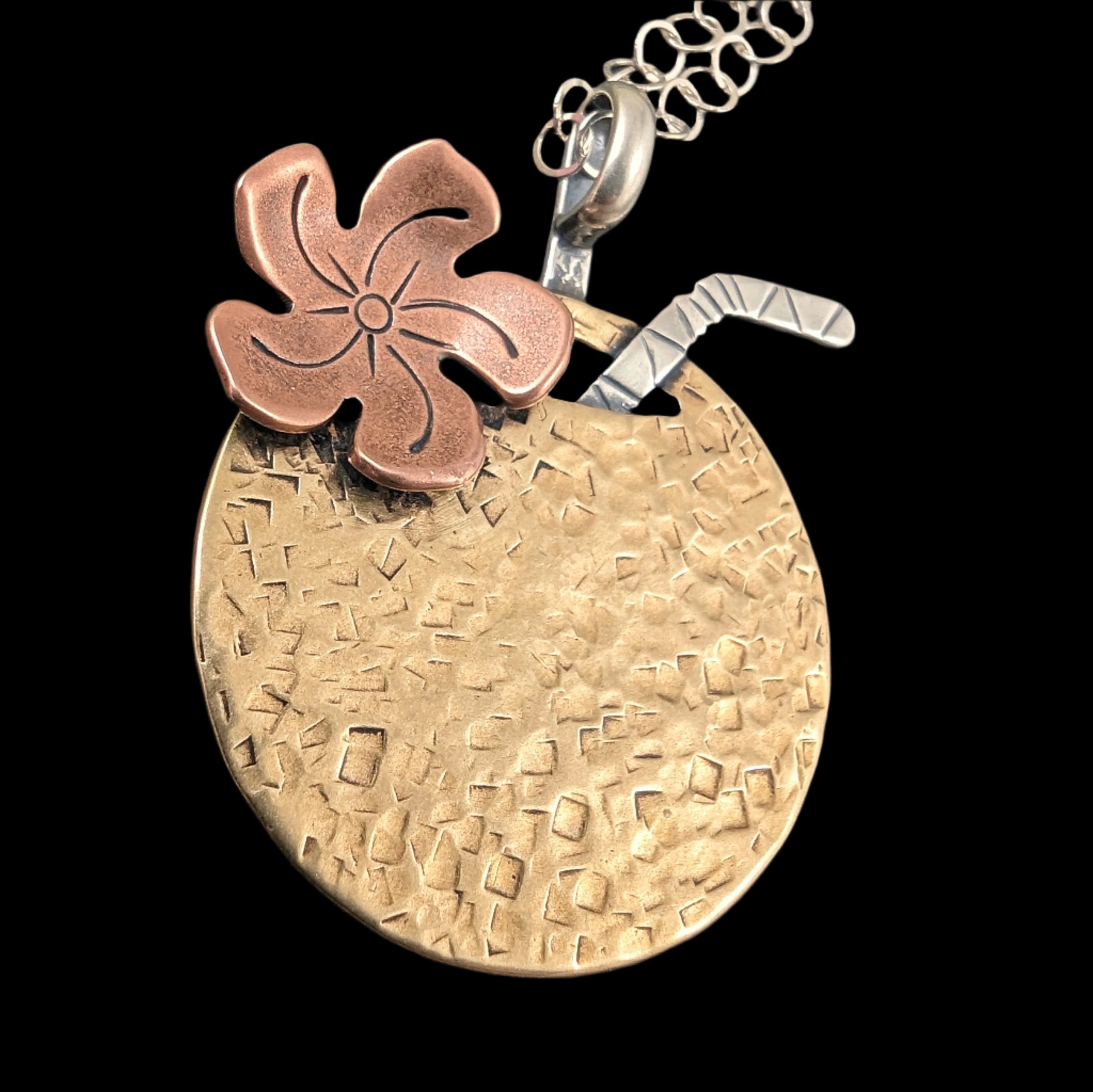 Tiki cocktail necklace in brass shaped like a coconut