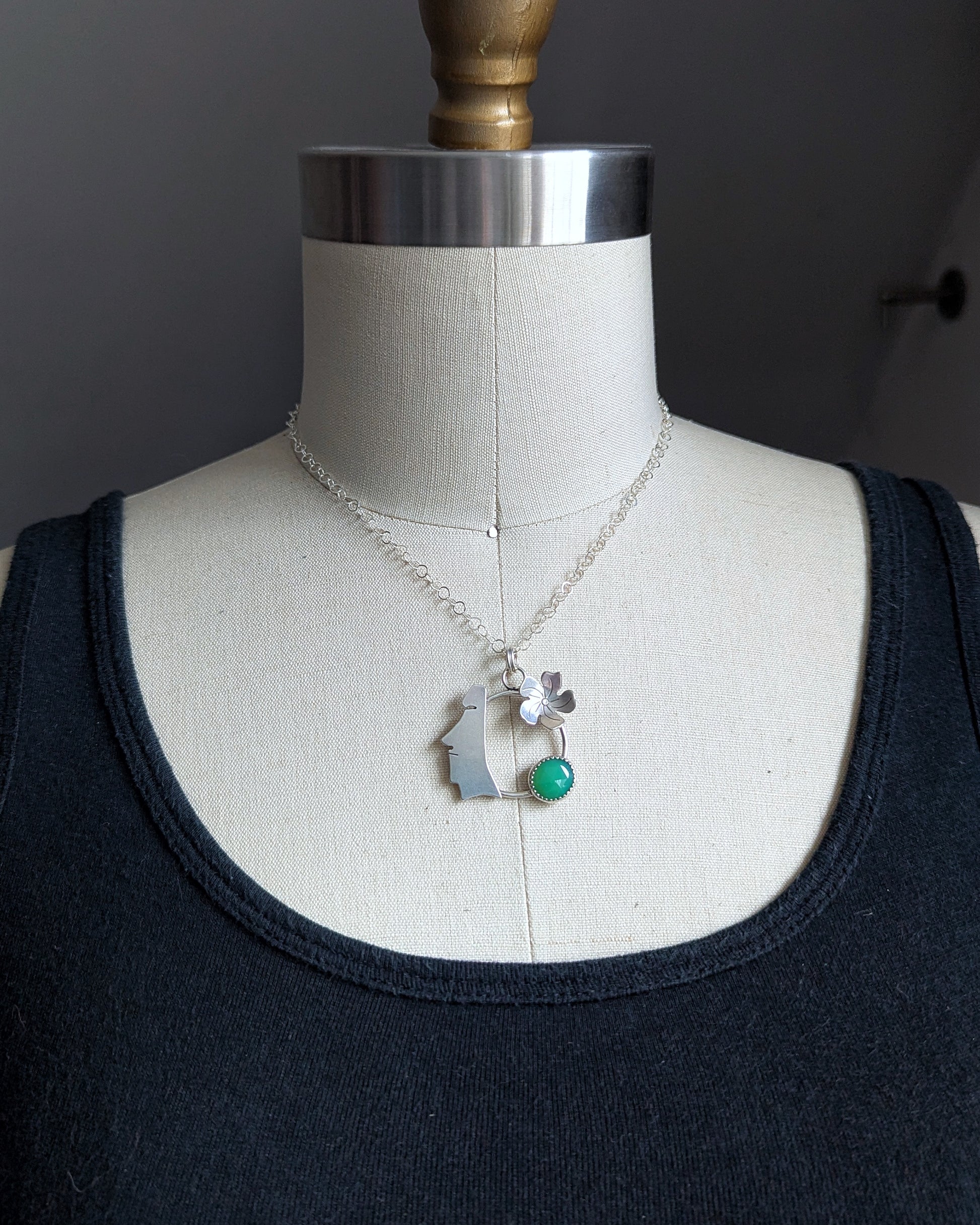 SIlver moai with green chalcedony necklace on dress form