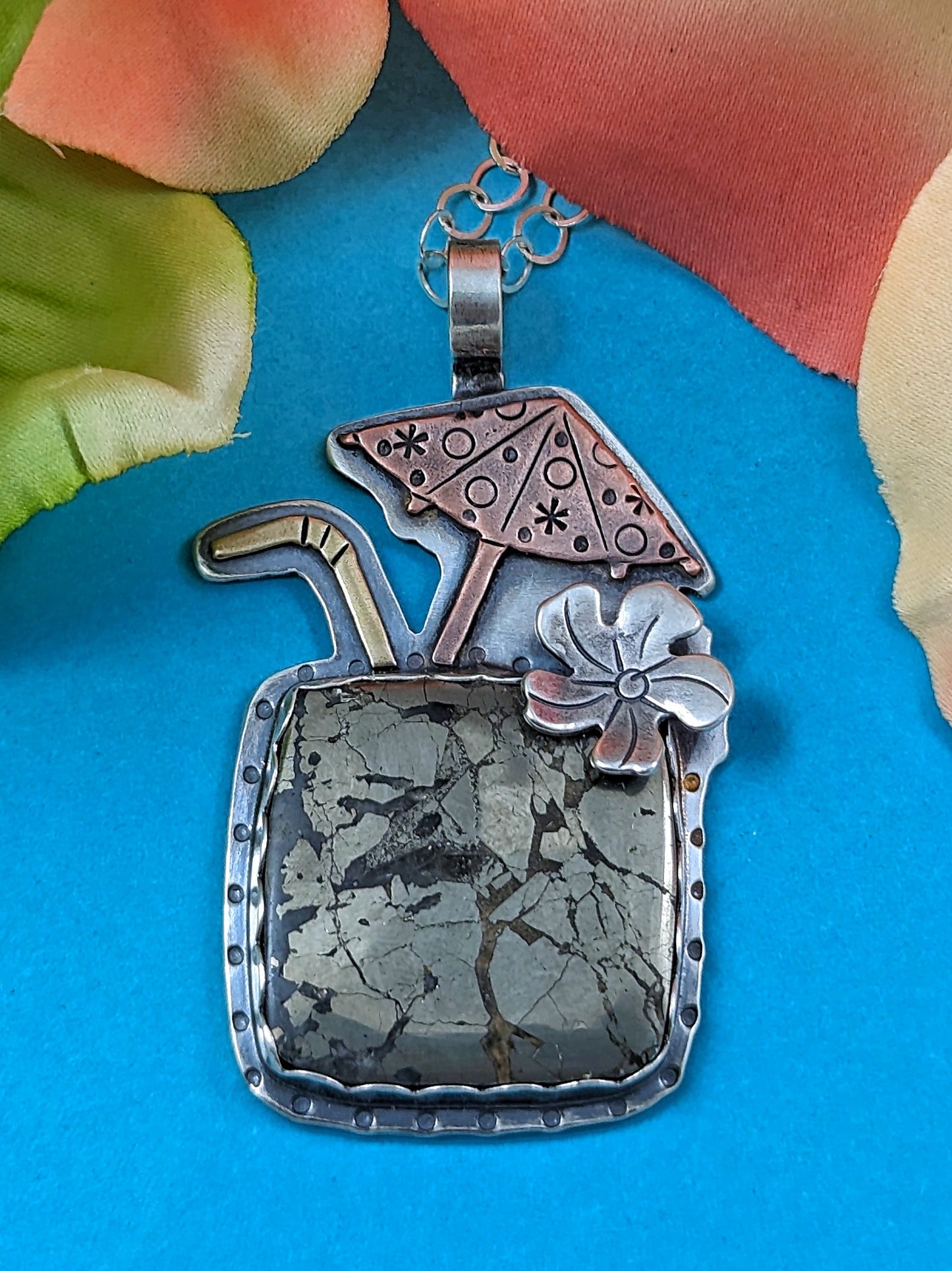 Marcasite drink necklace on turquoise background