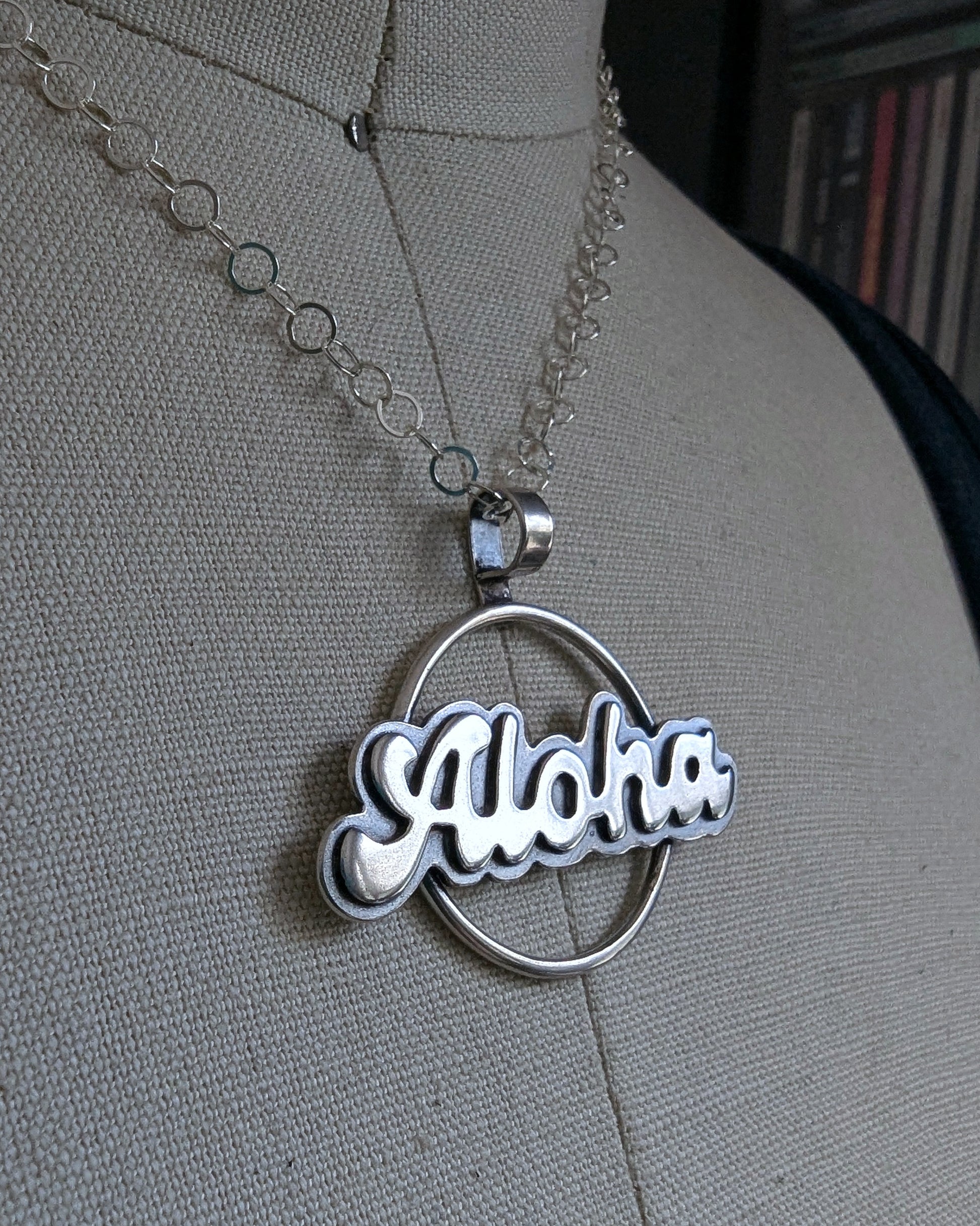 Side view on a bust of Aloha necklace