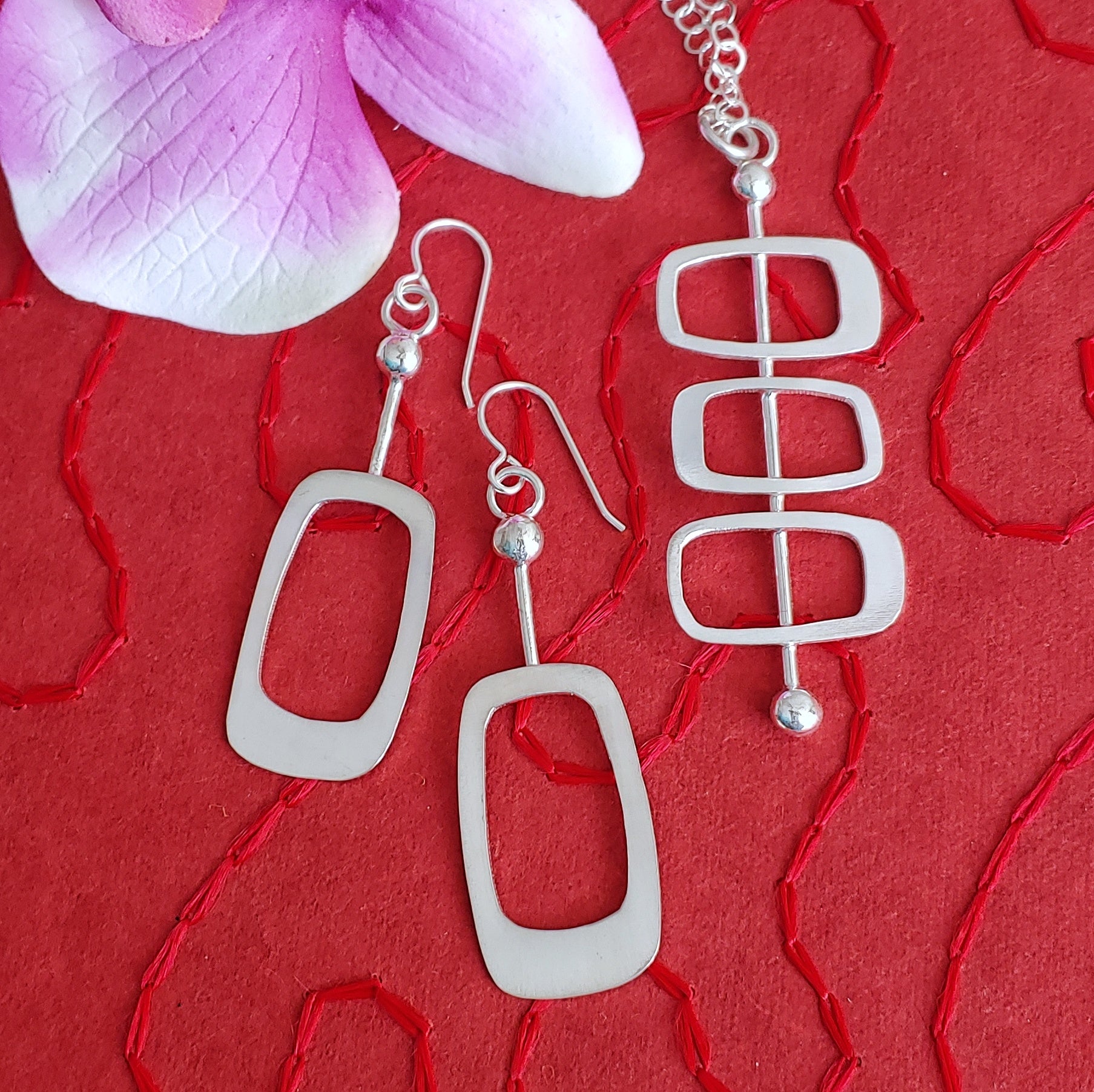 Handmade sterling silver mid century modern necklace and earrings set in the Googie style of architectural soft rectangles