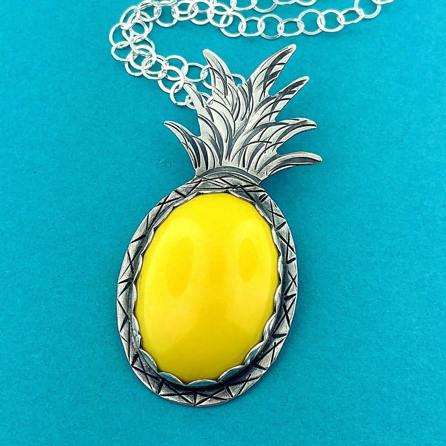 Beautiful yellow vintage lucite oval stone set in a handmade sterling silver pineapple