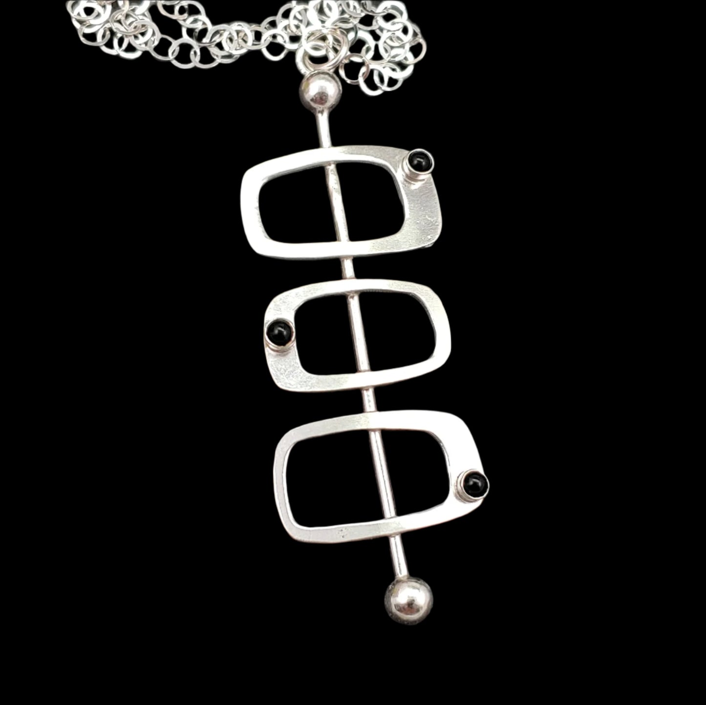 Handmade mid century modern style necklace in the Googie fashion with sterling silver rectangles and black onyx stone