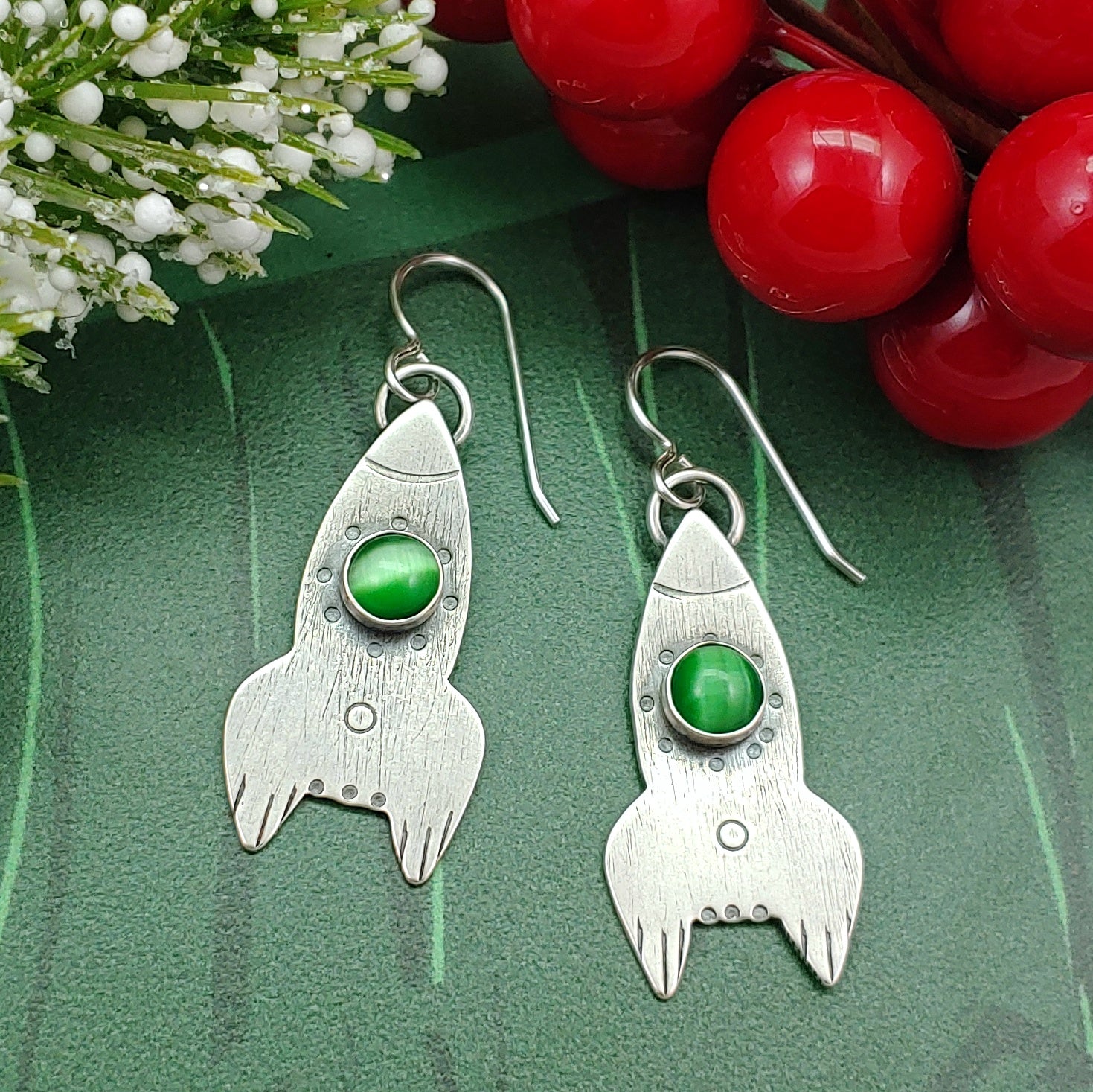 Rocket ship earrings in sterling silver with green stone