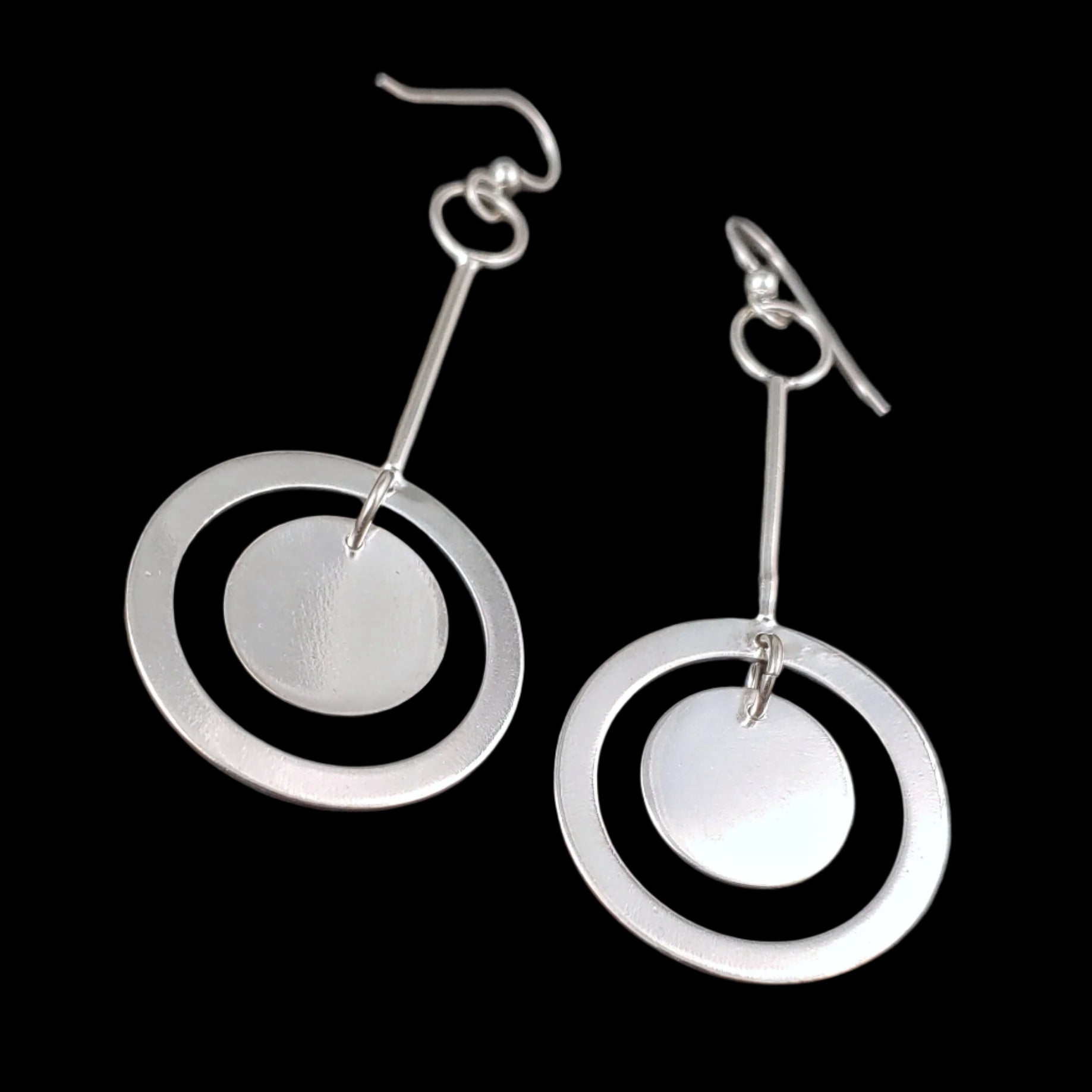 Another shot of the sterling silver minimalistic lightweight disc drop dangle earrings.