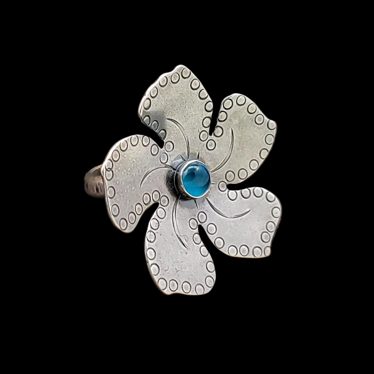 Sterling silver plumeria Tiki ring with light blue stone with fine detailing