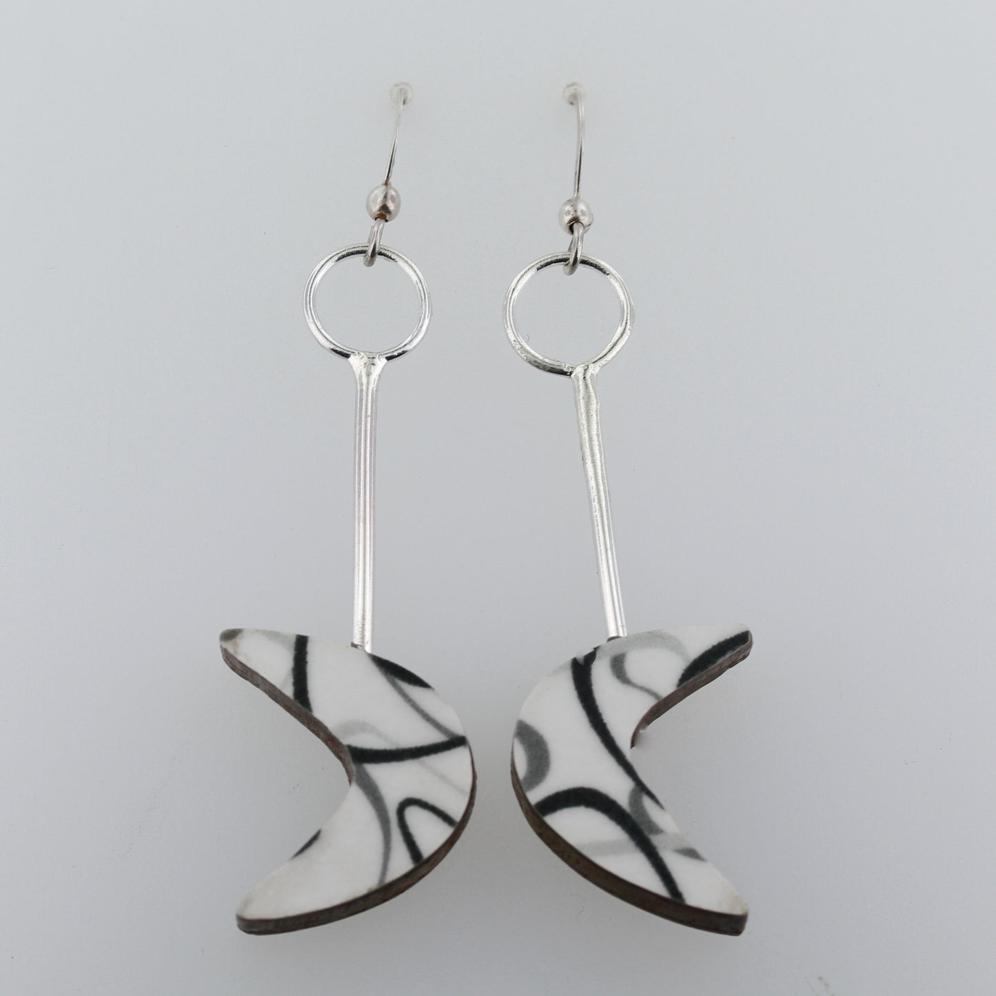 Boomerang laminate on wood earrings.