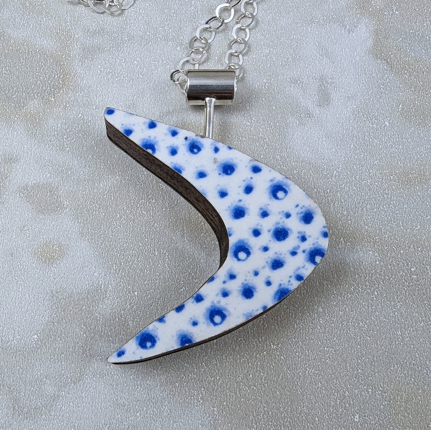 Boomerang Shaped Reversible Laminate Necklace - Black/Blue