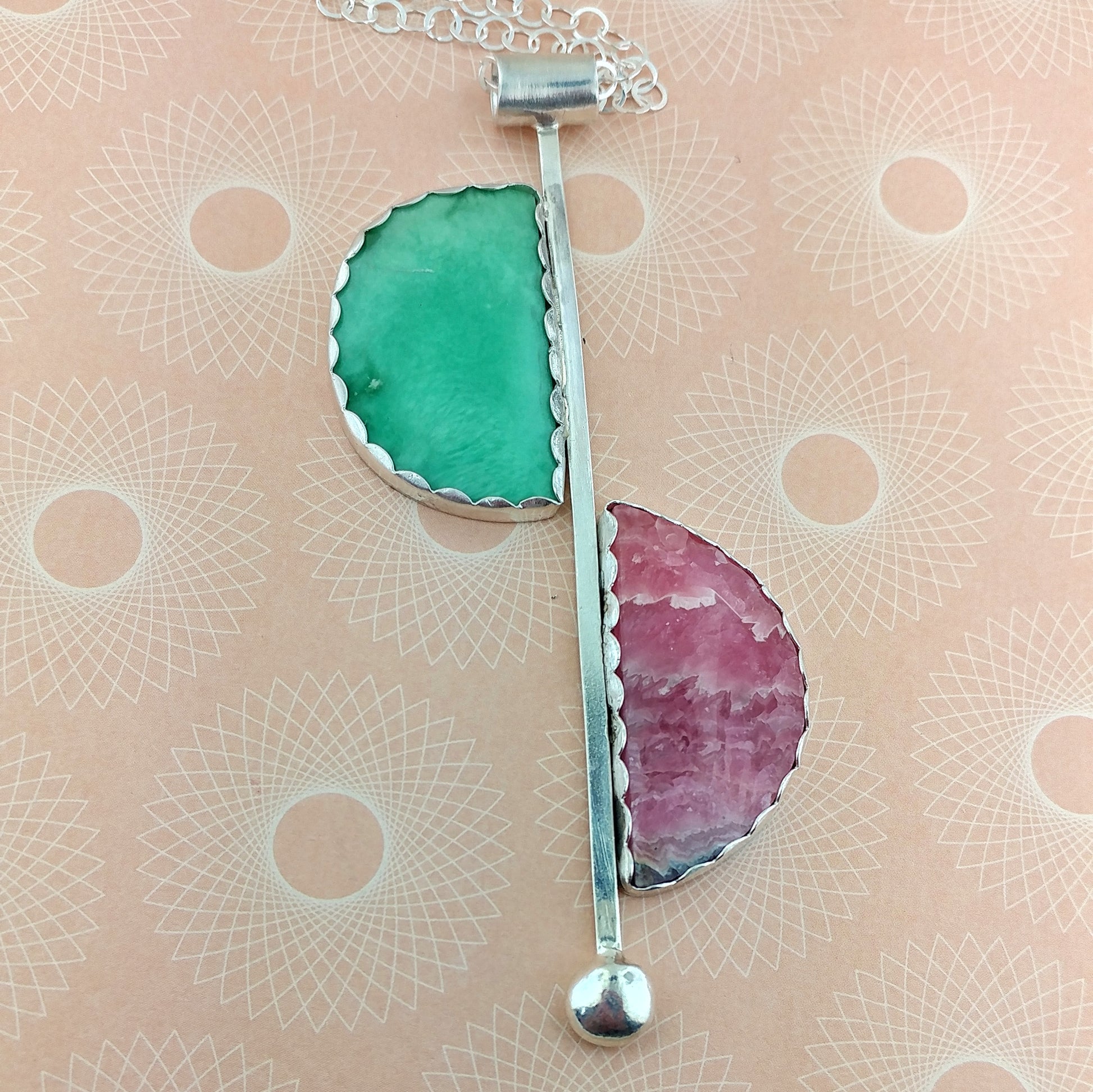 Modernist style half moon necklace handmade in sterling silver with pink and green stones