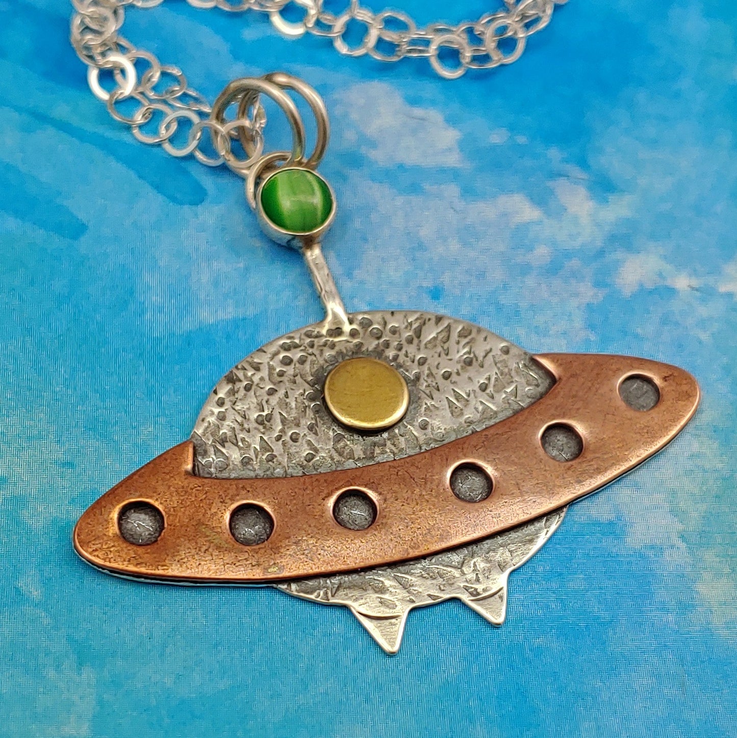 Spacecraft alien necklace handmade in sterling silver, copper, and brass.