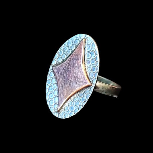 Mid century modern in spired ring featuring a retro diamond shaped starburst handmade in sterling silver
