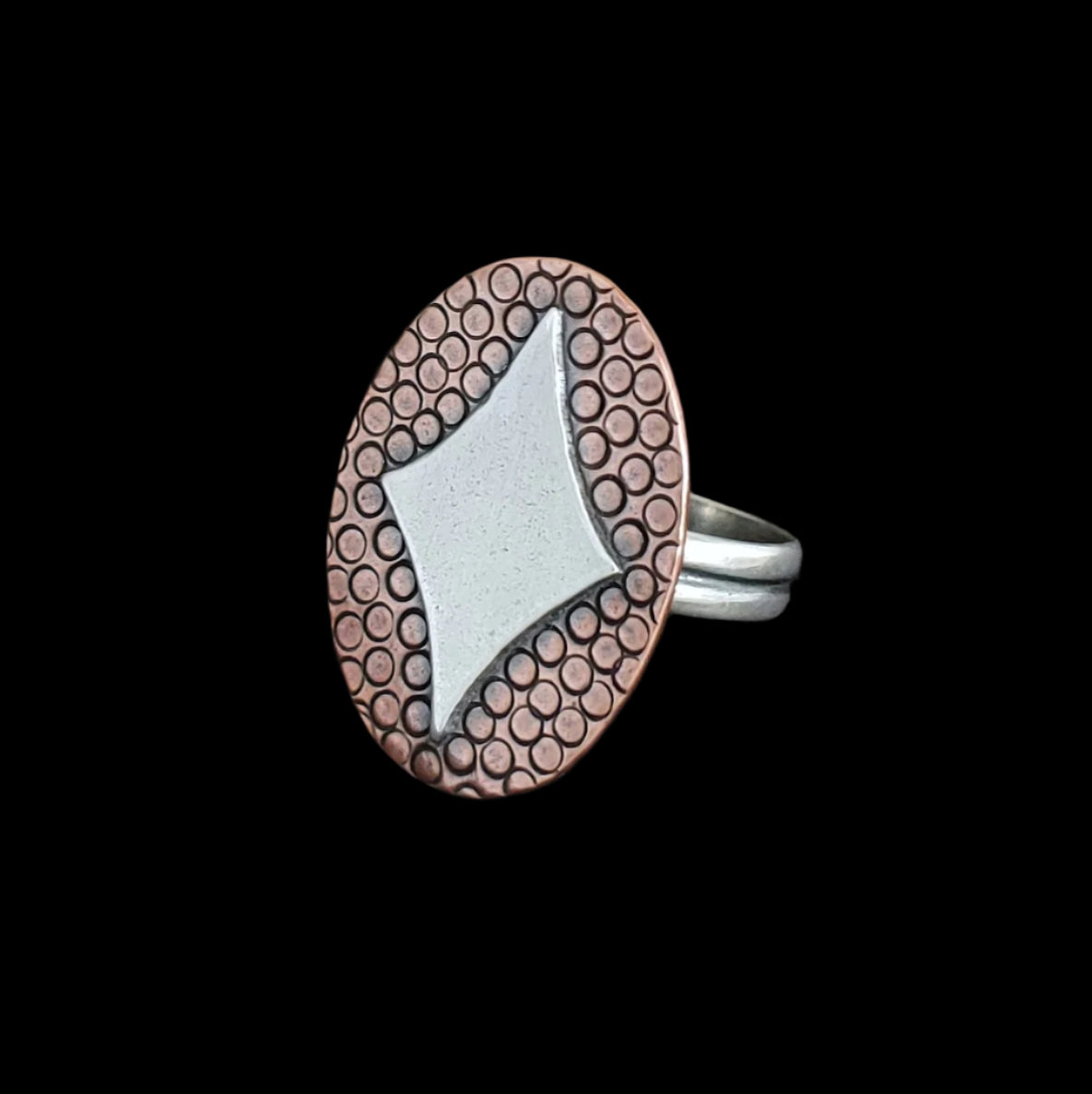Mid century modern inspired retro diamonds sterling silver ring featuring a silver star on a copper backplate