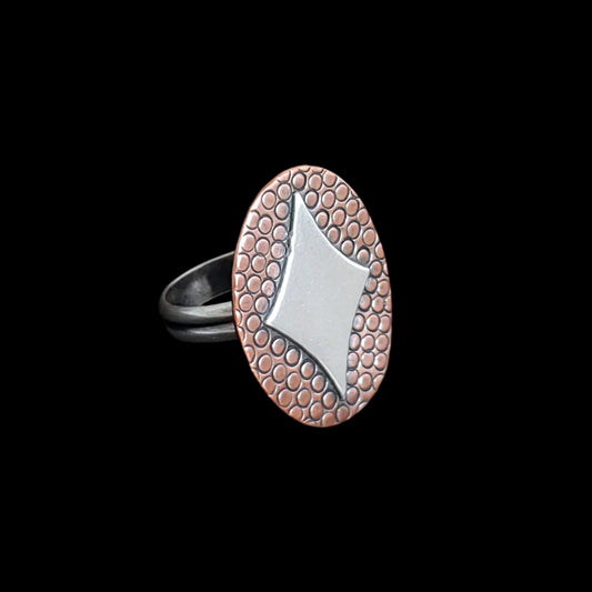 Handmade retro inspired sterling silver ring with a diamond shaped star on copper and sterling silver band