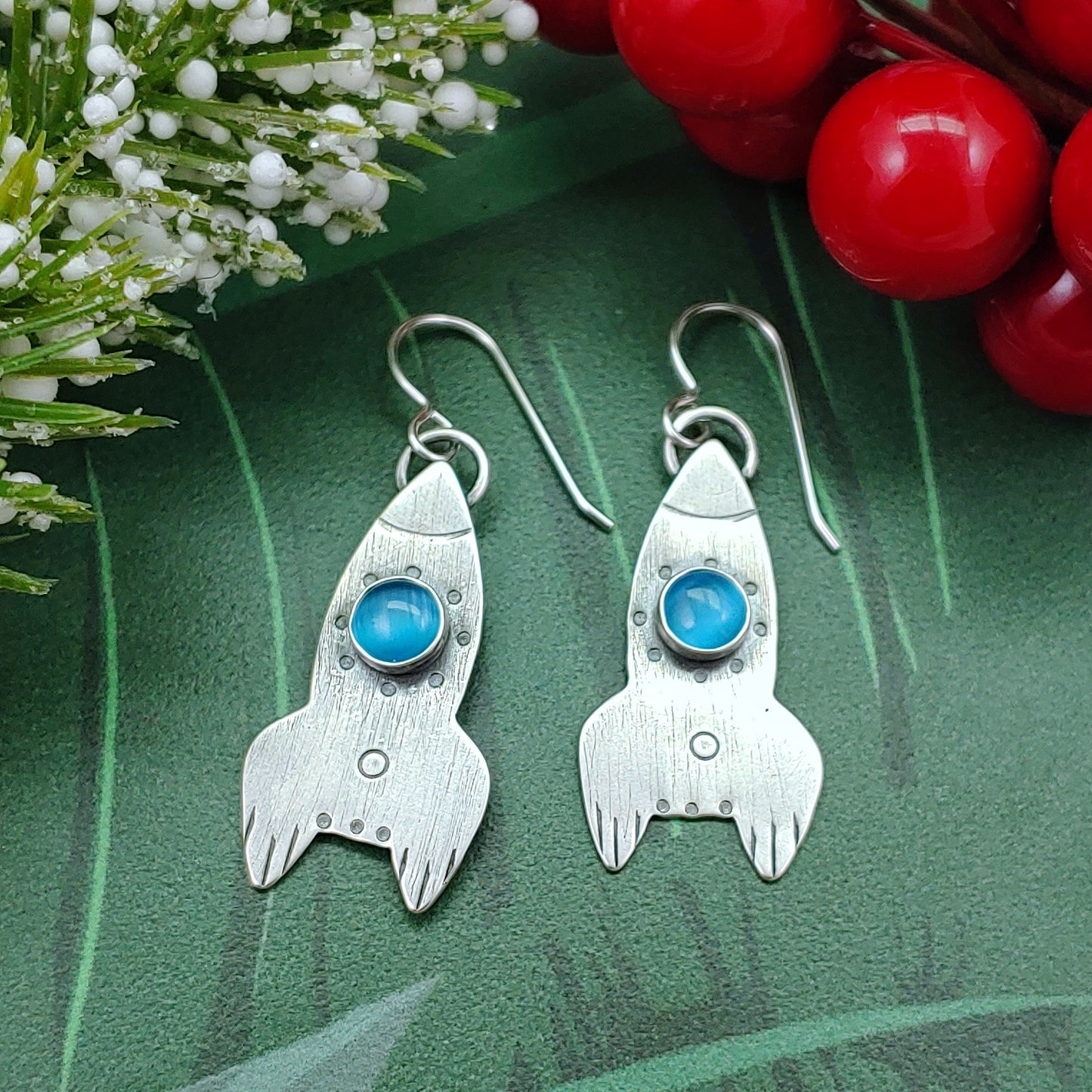 Rocket earrings in sterling silver with light blue cats eye stones