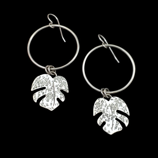 sterling silver monstera leaves Tiki earrings dangling from circle hoops that
