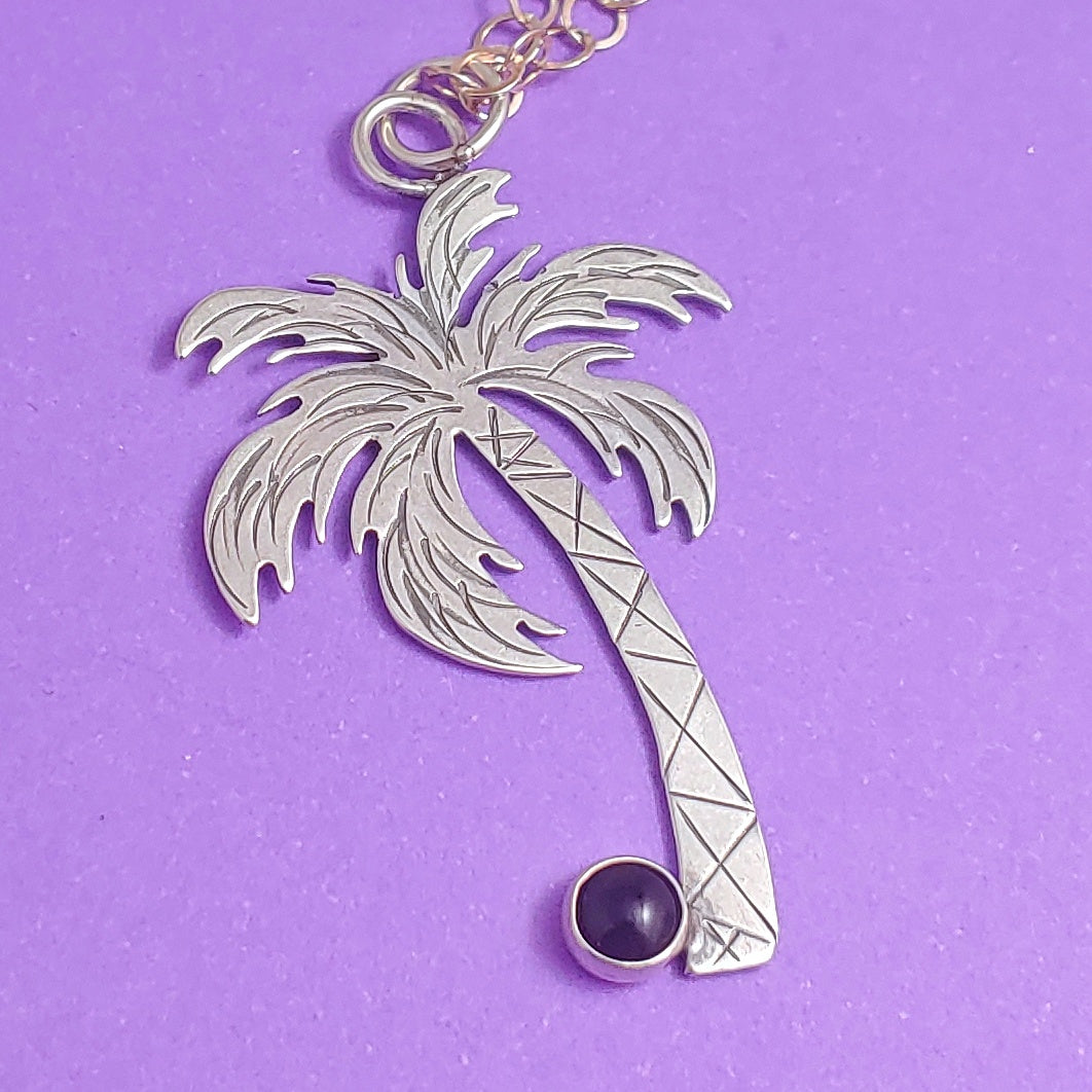 Sterling silver palm tree tropical necklace with a gemstone coconut.