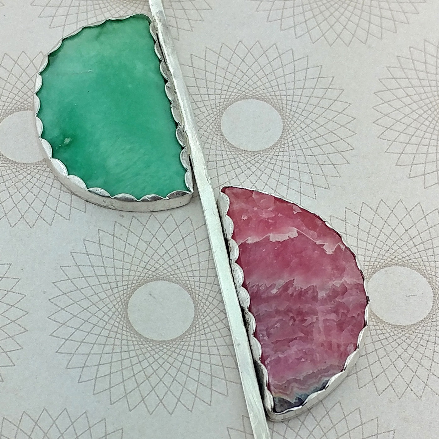 Closeup of the rhodochrosite and variscite stones in this sterling silver modernist necklace