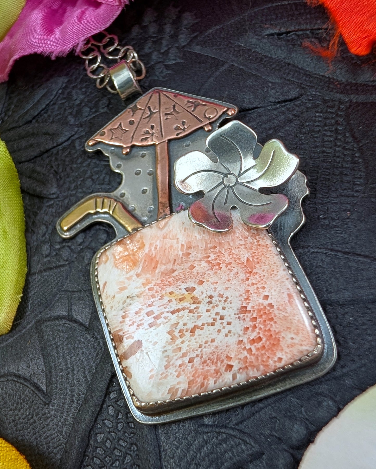 Tiki drink with scolecite and brass and copper umbrella necklace
