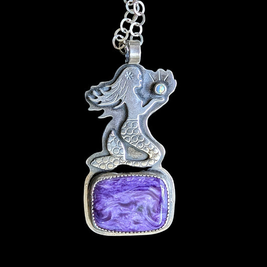 Mermaid sitting on charoite necklace