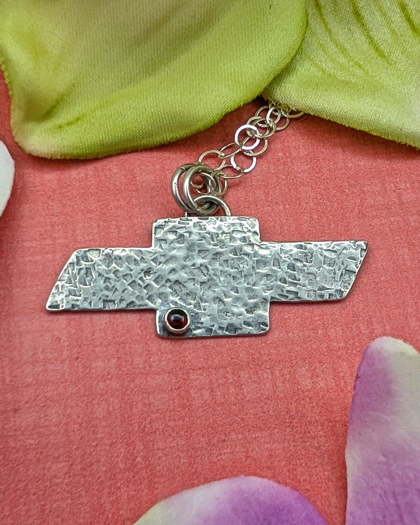 Sterling silver hammered Chevrolet bowtie necklace with garnet
