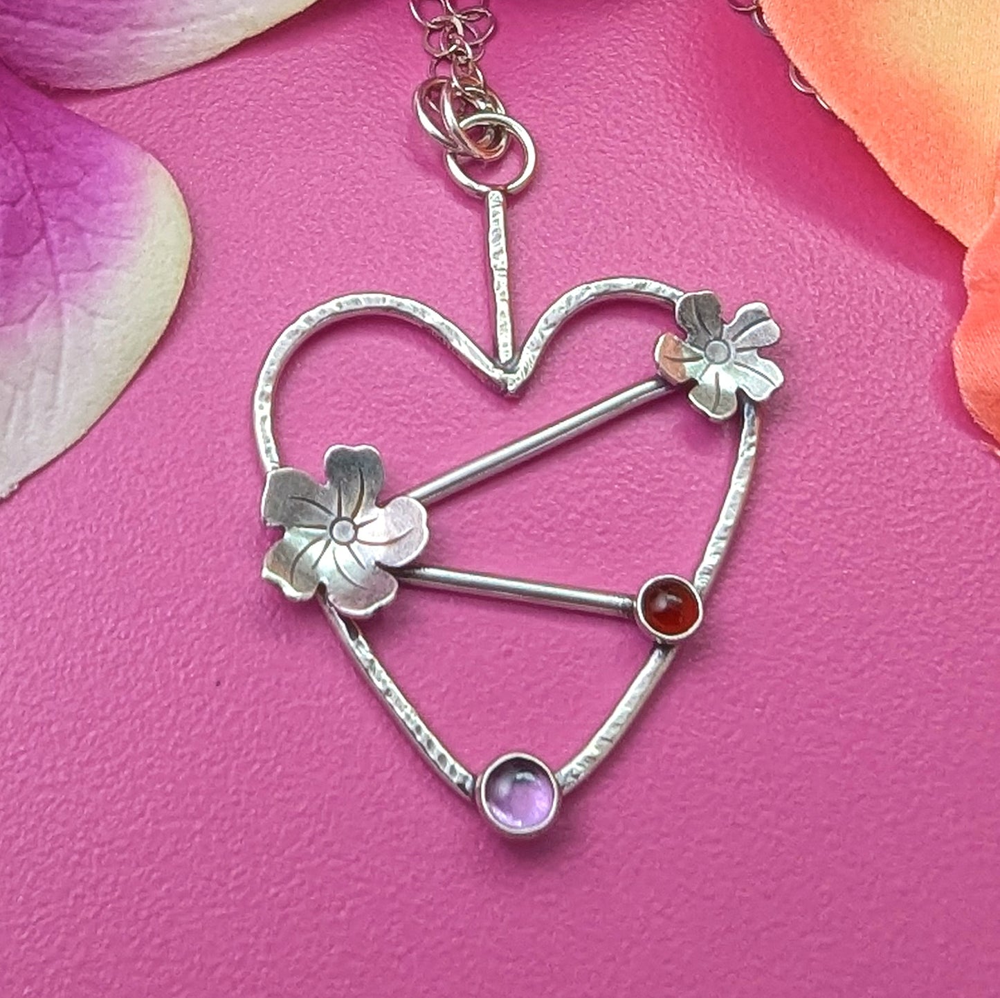 Sterling silver handmade heart necklace with Tiki plumeria flower details and carnelian and pink stones