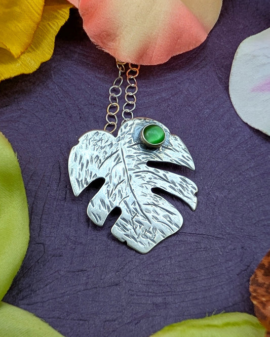 Sterling silver monstera leaf necklace with green cats eye